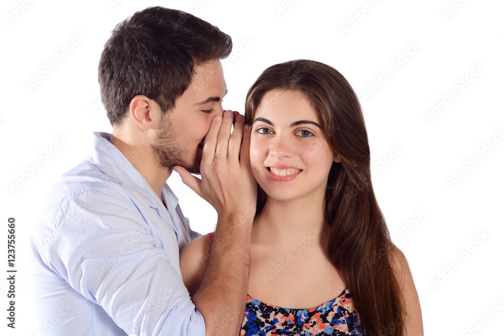 Man whispering secret to his girlfriend. Man whispering secret to his girlfriend.