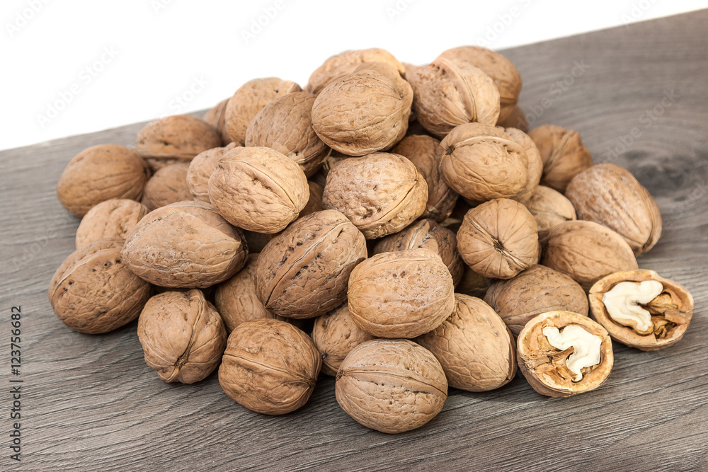 Group of walnuts on wooden surface. Natural health food Group of walnuts on wooden surface. Natural health food