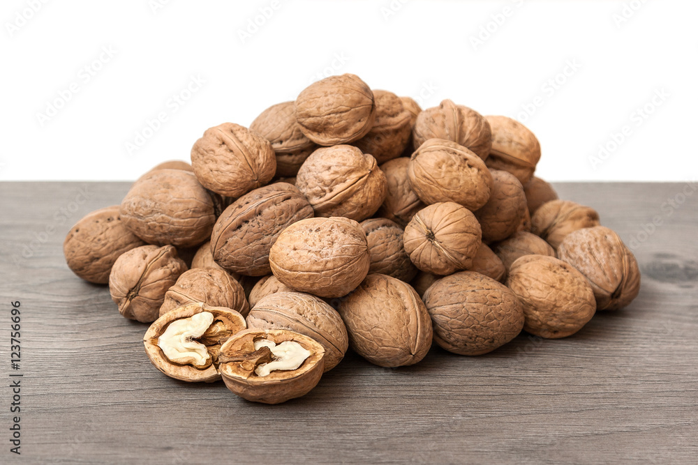 Group of walnuts on wooden surface. Natural health food Group of walnuts on wooden surface. Natural health food