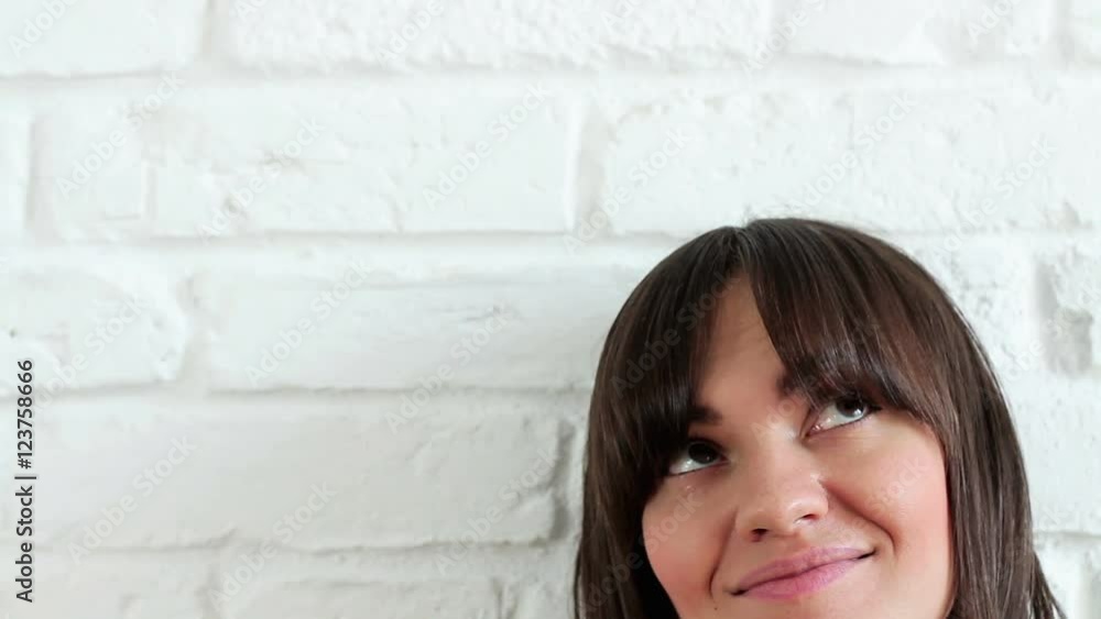 Portrait of a brunette woman looking at copyspace, close up Portrait of a brunette woman looking at copyspace, close up