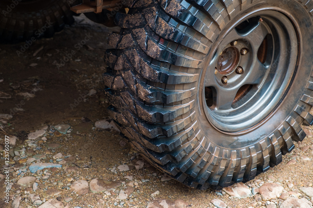Wet off road tire on dirt background Wet off road tire on dirt background