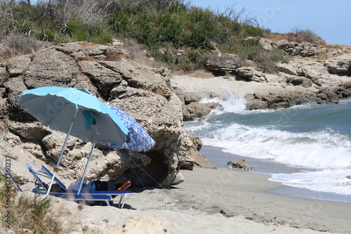 Corsica, marina di bravone, francia. beach with umbrellas photo