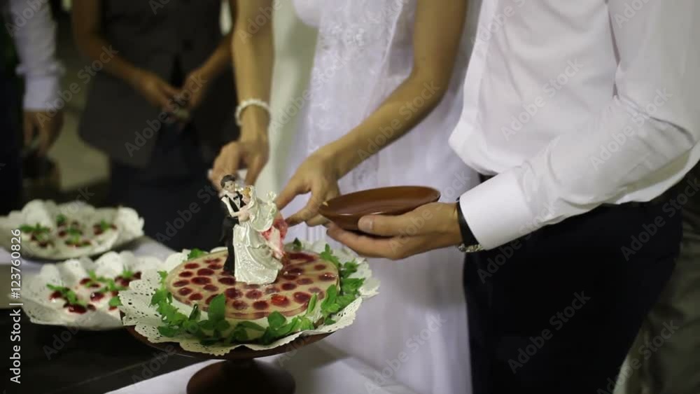 couple cut a piece of fruit wedding cake couple cut a piece of fruit wedding cake