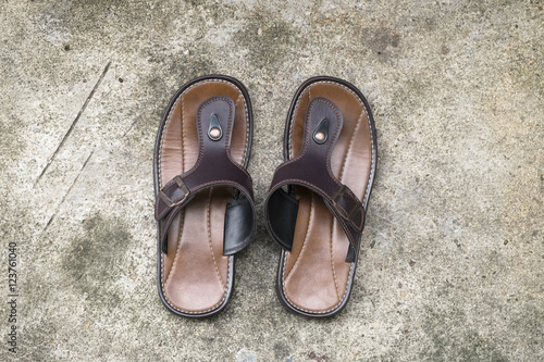 Leather sandals on Concrete background