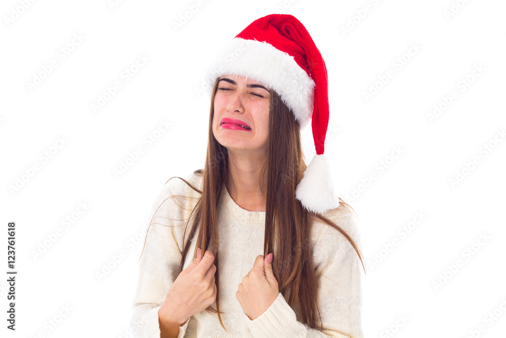 Woman in red christmas hat crying Woman in red christmas hat crying