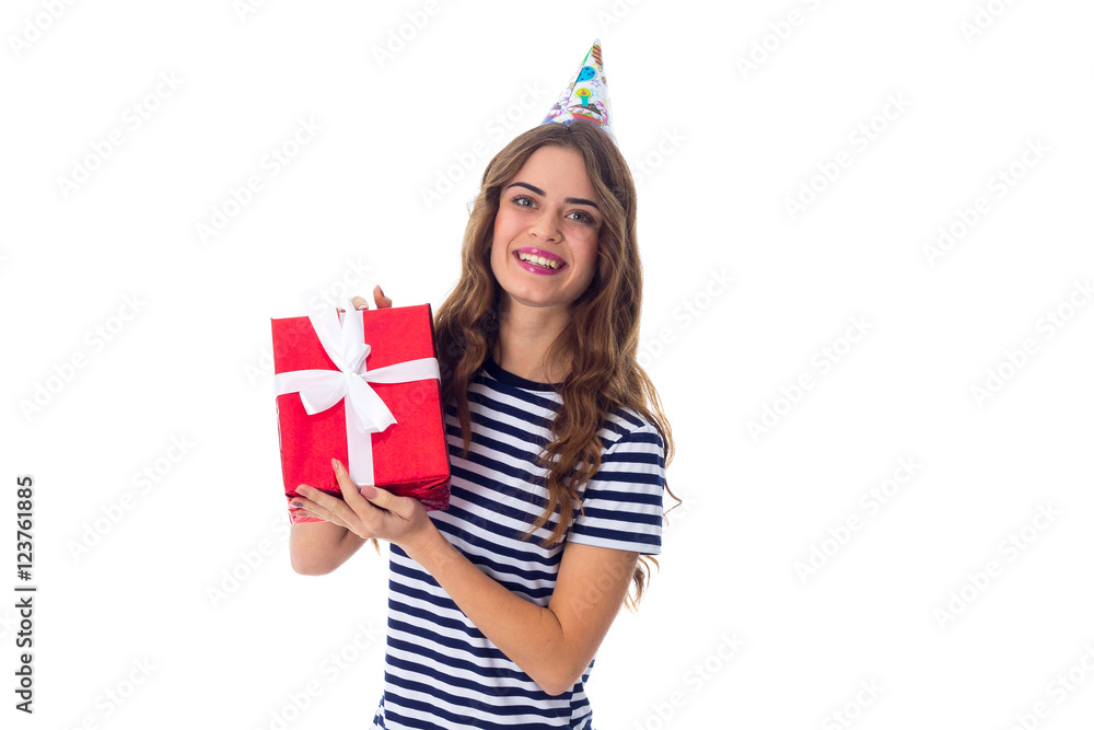 Woman in celebration cap holding a present Woman in celebration cap holding a present