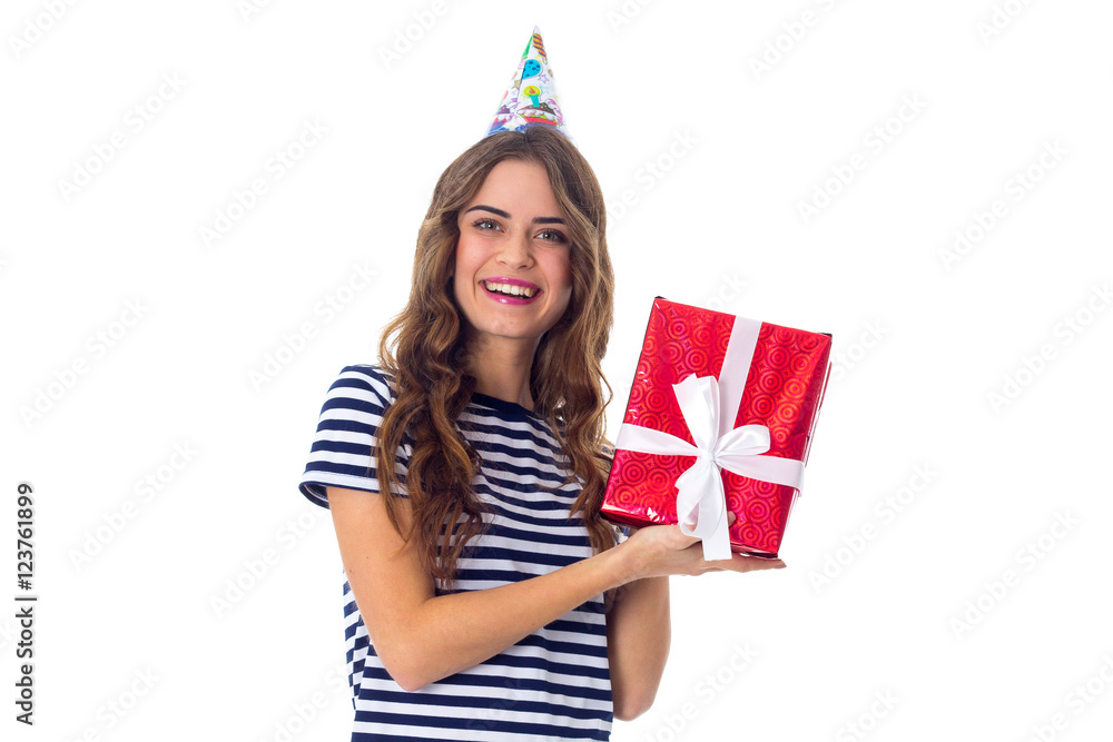 Woman in celebration cap holding a present Woman in celebration cap holding a present