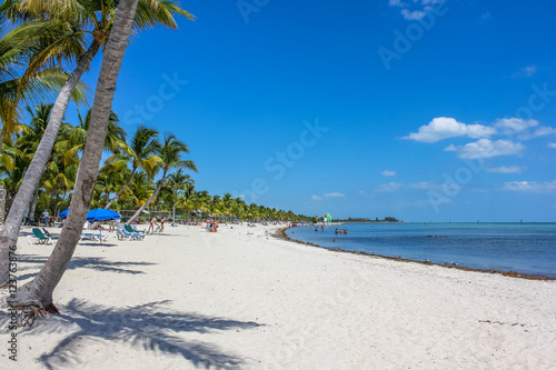 Fototapeta Naklejka Na Ścianę i Meble -  The spectacular beach with fine white sand of Smathers Beach, Key West, Florida. Smathers Beach is Key West's longest beach and is located on the Atlantic Ocean side.