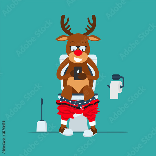 Santa's deer hipster Rudolf sits on  toilet bowl with phone in hands.Reindeer Rudolf in toilet. Toilet bowl, toilet paper and brush for toilet bowl. Greeting Christmas card 2017
