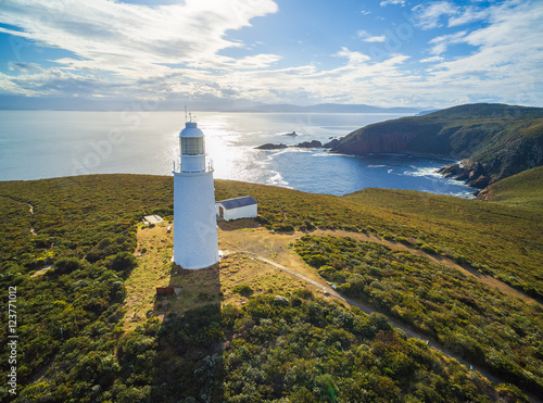 Aerial view of Bruny Island Lighthouse at sunset. Tasmania, Australia photo