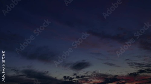 Dark twilight sunset sky cloudscape time-lapse 4k nature video: red clouds moving on night evening haven. Day to night transition
