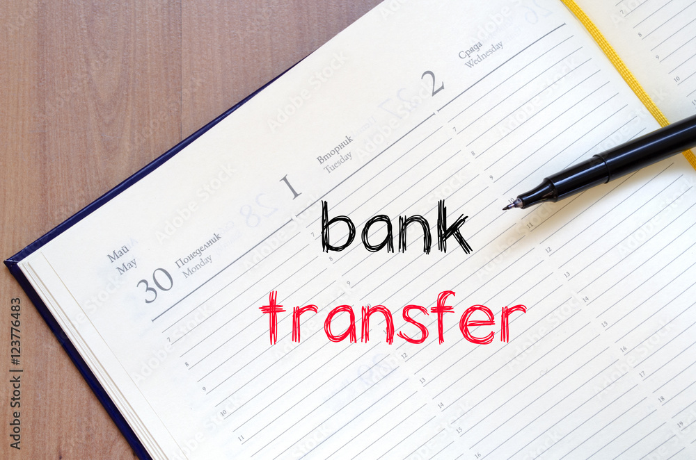 Bank transfer text concept on notebook Bank transfer text concept on notebook