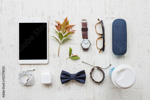 Flat lay, Men's accessories, coffee cup and tablet on white wooden board background