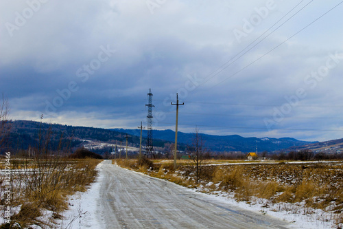 Winter asphalt road in Carpathian mountains, Ukraine © olyasolodenko