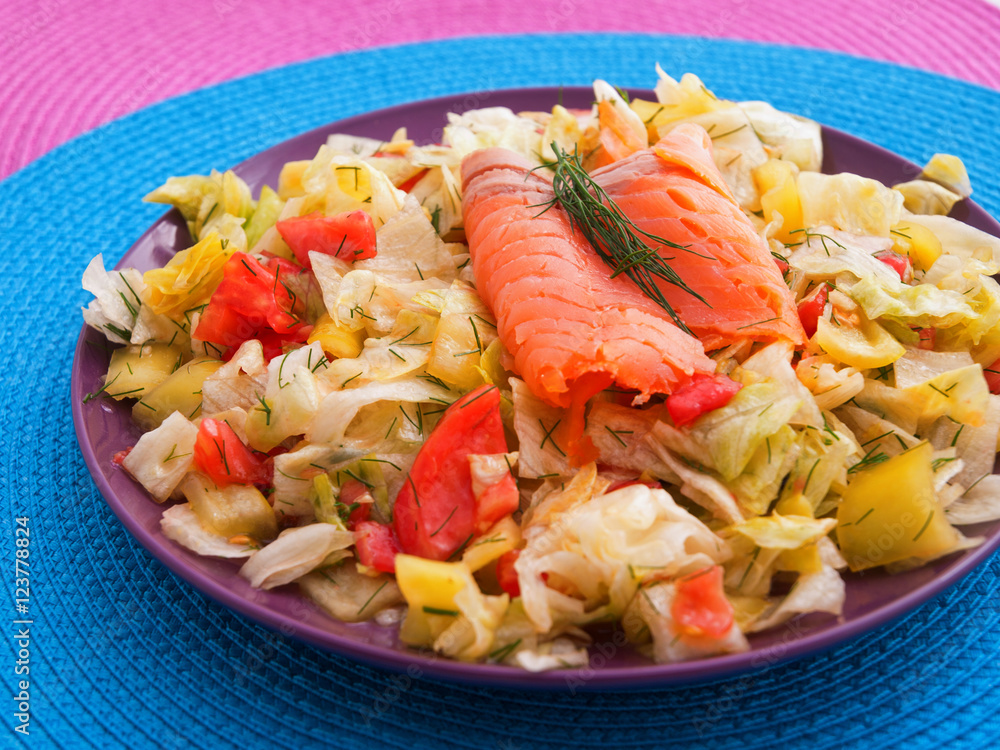 Green salad with tomatoes and smoked salmon. Horizontal shot Green salad with tomatoes and smoked salmon. Horizontal shot