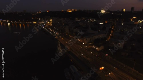 Wallpaper Mural Aerial View of European City at Night with Illuminated Light from Cars, Seafront. Shot in 4K UHD Torontodigital.ca