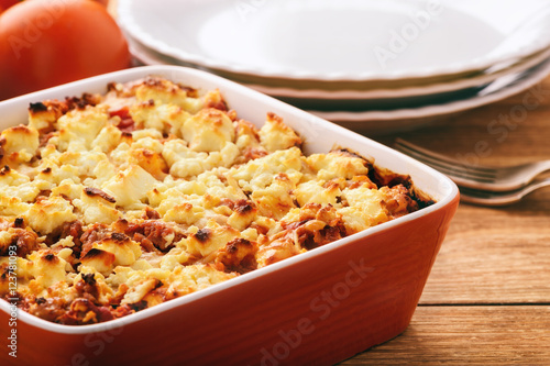 Pastitsio -greek casserole with pasta, meat, tomatoes and feta cheese.