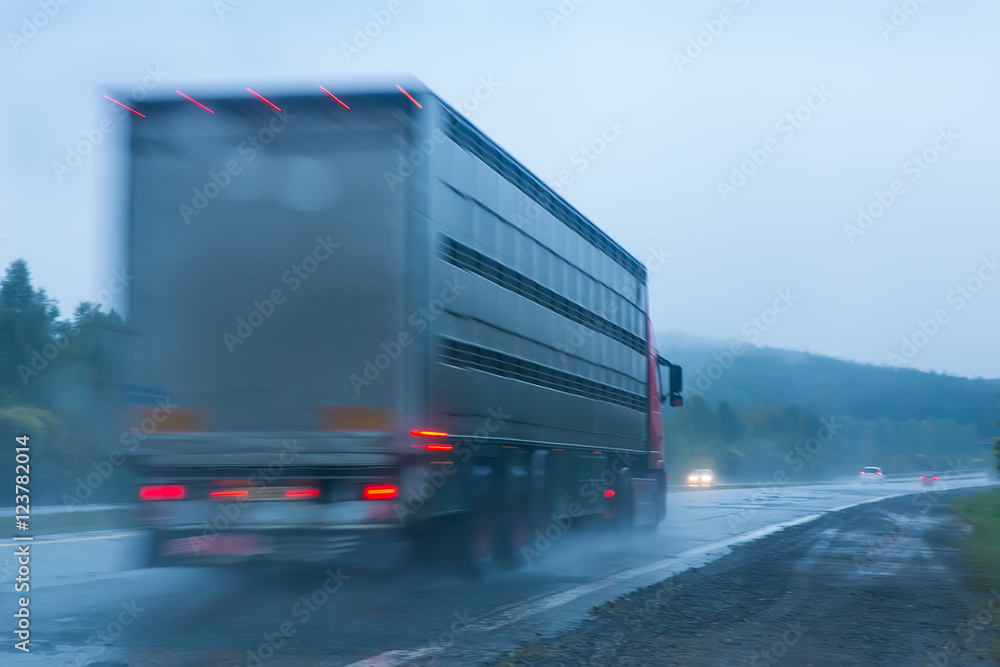 truck going on the highway to rain
