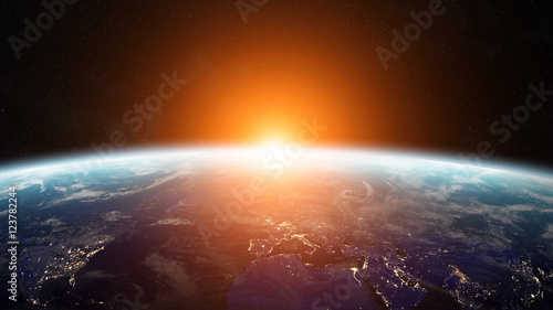 Fototapeta Naklejka Na Ścianę i Meble -  Sunrise over planet Earth in space 3D rendering elements of this