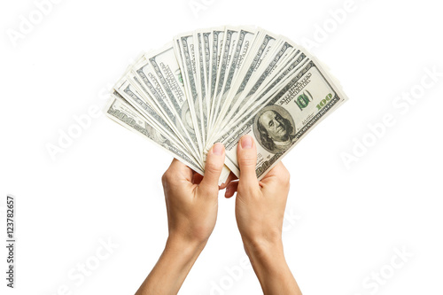 Hands holding a 100 bill . Hands holding a lot of money .