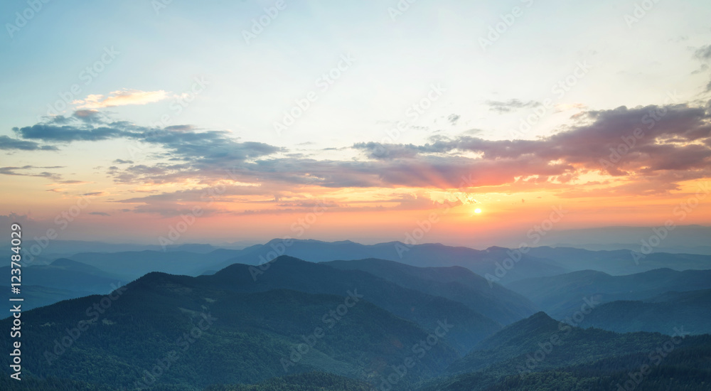 Mountains during sunset. Beautiful natural landscape in the summer time..