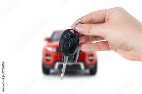 Hand holding keys to new car. Buy or selling business composition