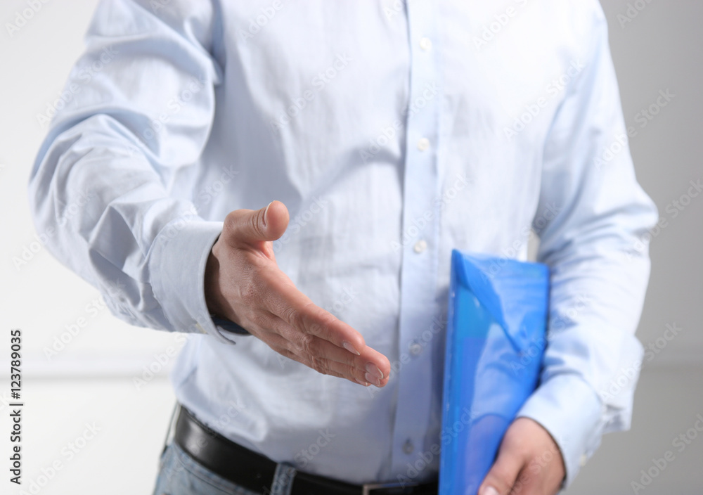 Businessman ready to shake hand in office Businessman ready to shake hand in office