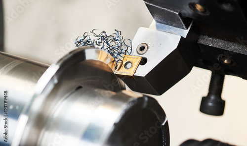 cutting tool at mechanical turning metal working photo