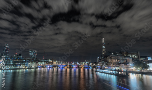 Night skyline of London City from the Millennium bridge, London, United Kingdom