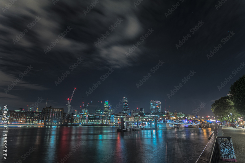 Fototapeta premium Night skyline of London City from the Millennium bridge, London, United Kingdom