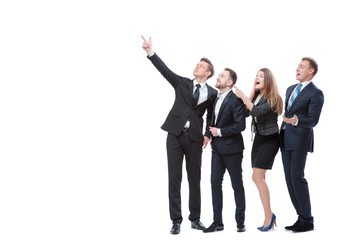 Just look at this! Full length of group of surprised and amazed business people looking and pointing away. Isolated on white.