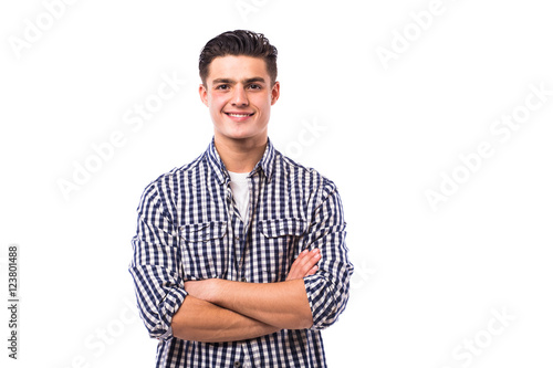 Elegant young handsome man with crossed hands in shirt.