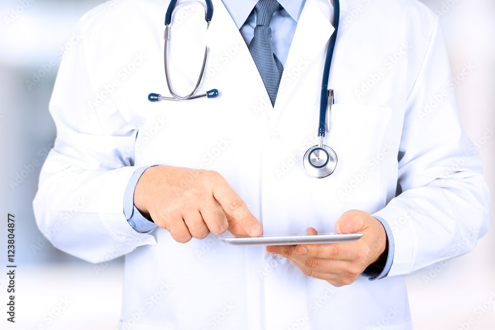 Doctor working with tablet computer. Doctor working with tablet computer.