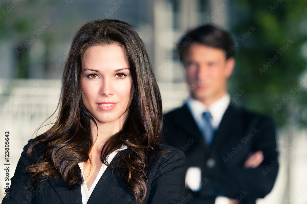 Businessman and Businesswoman outdoors downtown Businessman and Businesswoman outdoors downtown