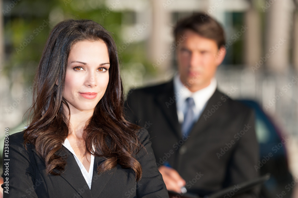 Businessman and Businesswoman outdoors downtown Businessman and Businesswoman outdoors downtown