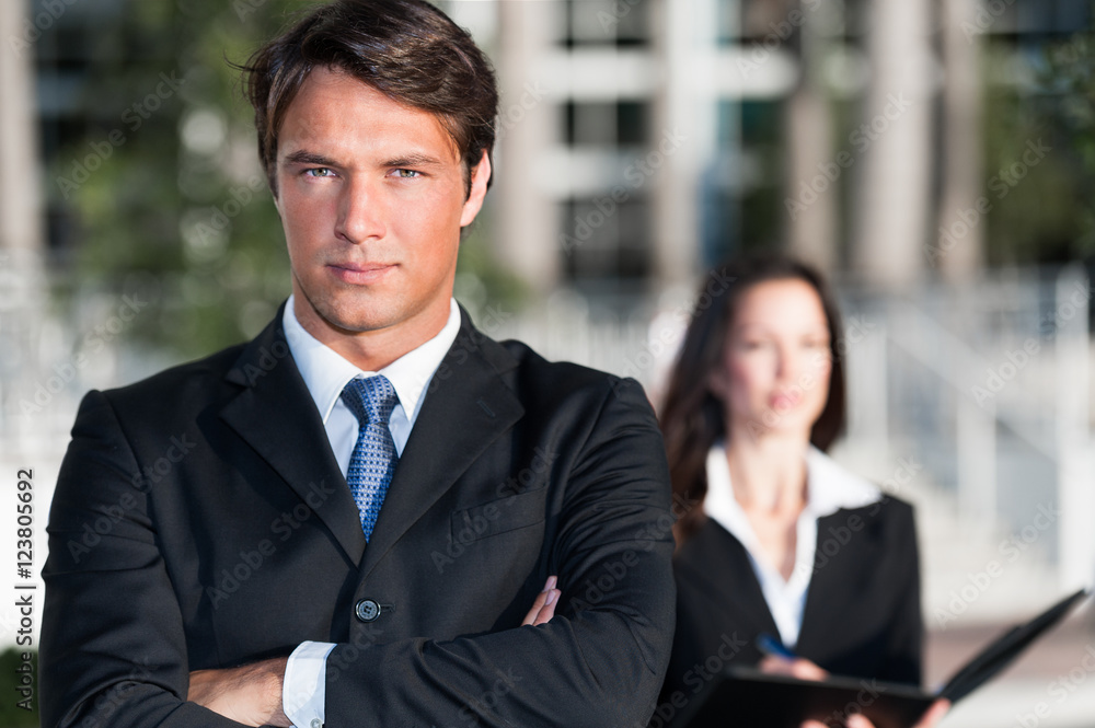 Businessman and Businesswoman outdoors downtown Businessman and Businesswoman outdoors downtown