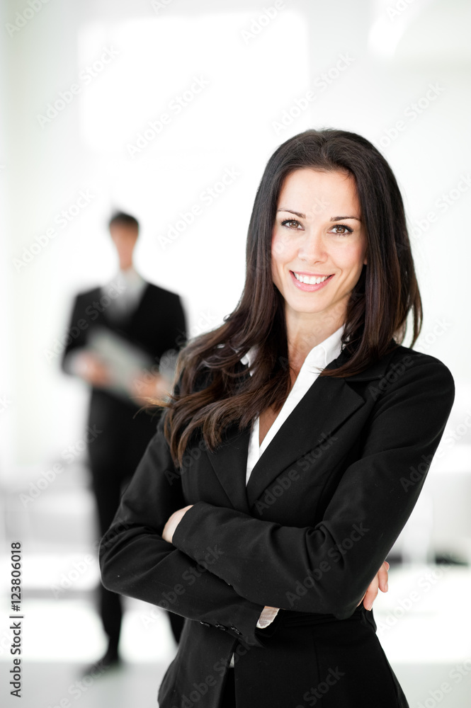 Businesswoman and Businessman in Lobby Businesswoman and Businessman in Lobby