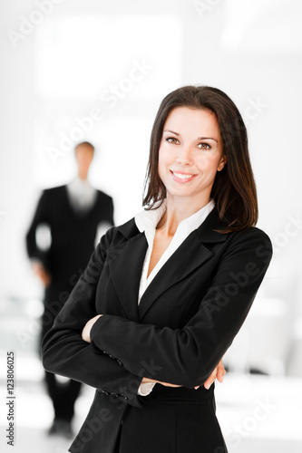 Businesswoman and Businessman in Lobby