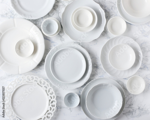 White plates on marble table