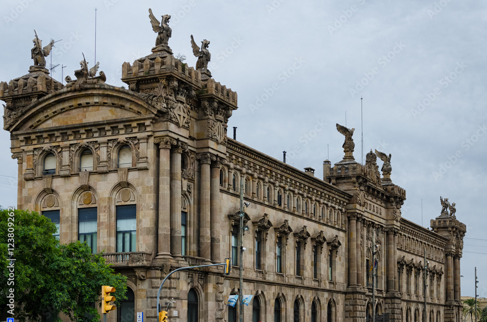 Historic custom house building with statues in Barcelona, Spain