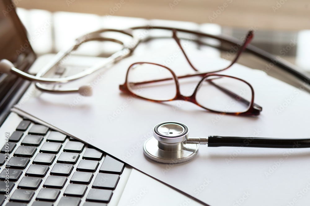 doctor online, medical concept, stethoscope and glasses on laptop, diagnosis doctor online, medical concept, stethoscope and glasses on laptop, diagnosis