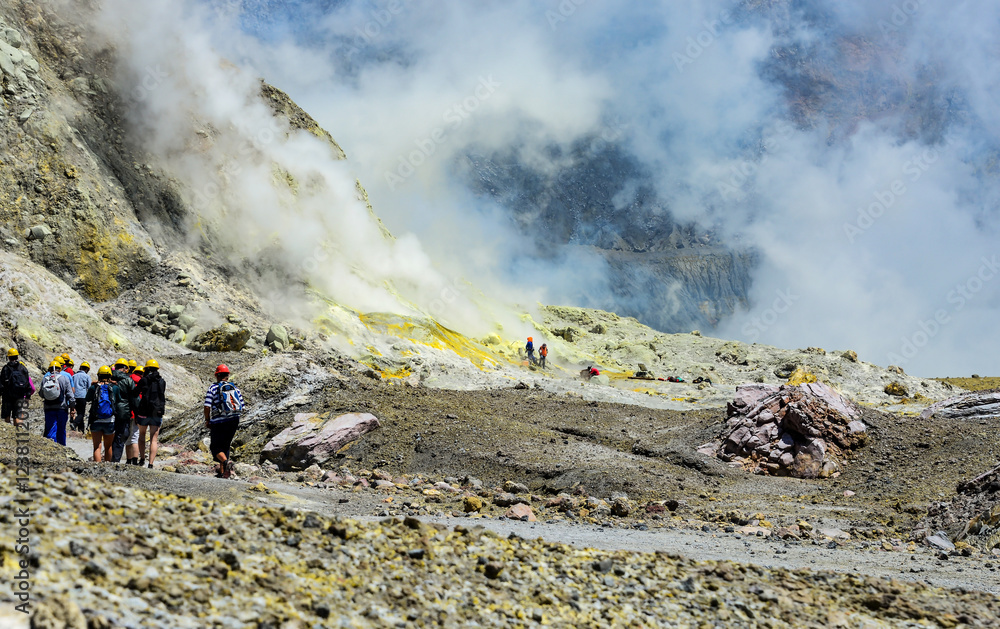 group of tourist on volcano white island, new zealand