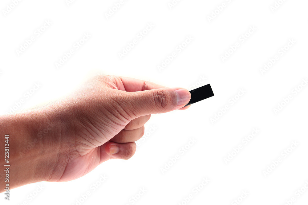 Hand holding USB data storage or connecting computer device with USB cable, isolated on white background