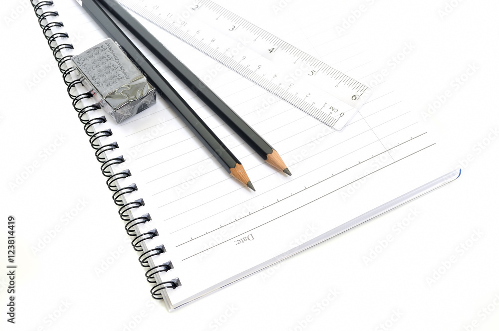 Blank page with pencils, eraser and ruler isolated on white background Blank page with pencils, eraser and ruler isolated on white background