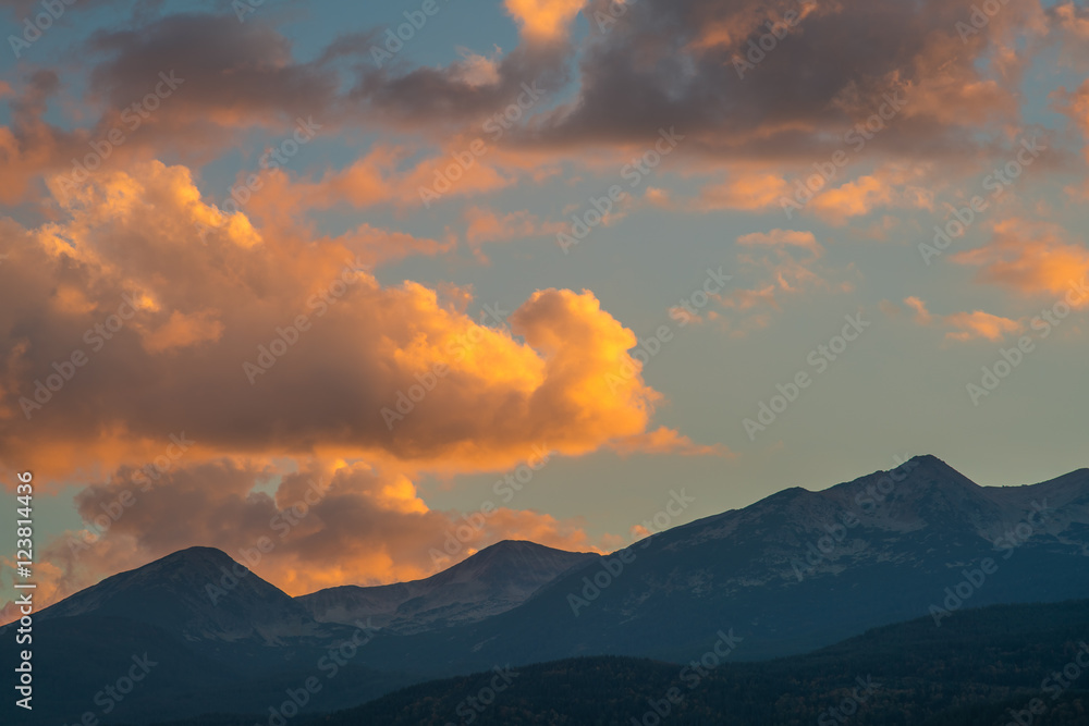 The picturesque mountain view on the background of cloud stream. Wide angle