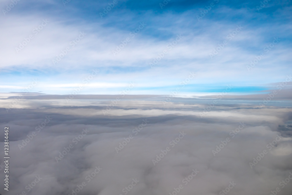 The blue sky against the background of cloud stream. View from the plane. Wide angle The blue sky against the background of cloud stream. View from the plane. Wide angle