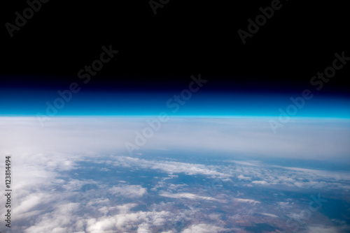 The high altitude on the background of cloud stream. View from the plane. Wide angle