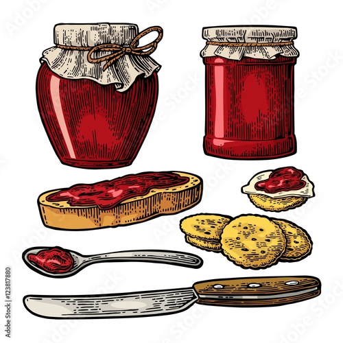 Jar with packaging paper, spoon, knife and slice of bread with jam.