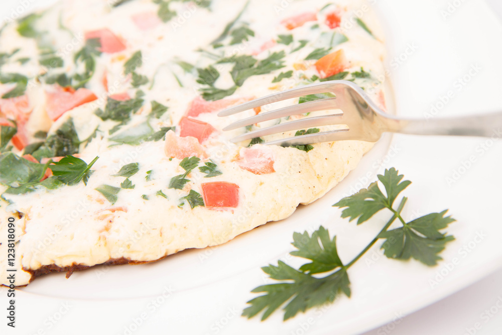 Omelette with tomatoes, fresh spinach and parsley Omelette with tomatoes, fresh spinach and parsley