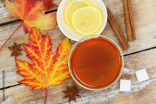 Fototapeta Naklejka Na Ścianę i Meble -  Tea, autumn leaf, lemon, star anise and cinnamon
